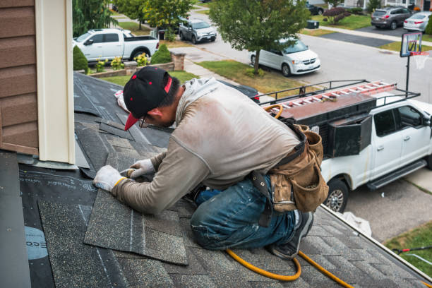 Professional Roofing technician working in University Park, IL